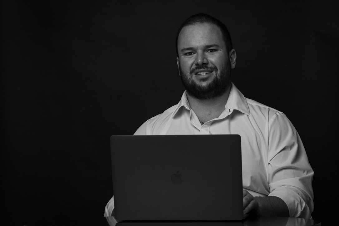 Herzen Co. founder working at a laptop